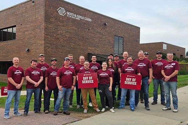 Display ad for Day of Service; Xcel energy team volunteering