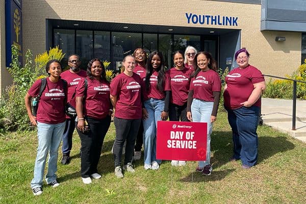 Display ad for Day of Service; Xcel energy team volunteering